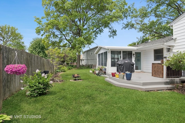 212 E 11th Ave, Naperville, IL 60563 - view of yard with a sunroom, a wooden deck, and a fire pit