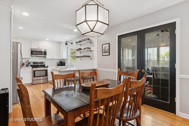 212 E 11th Ave, Naperville, IL 60563 - dining area with french doors, light wood finished floors, and recessed lighting