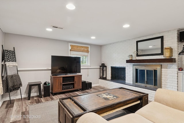 212 E 11th Ave, Naperville, IL 60563 - living room featuring wood finished floors, a brick fireplace, recessed lighting, and a wainscoted wall