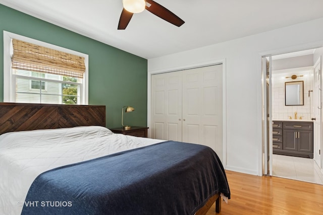 212 E 11th Ave, Naperville, IL 60563 - bedroom featuring light wood-style floors, a closet, a ceiling fan, and connected bathroom