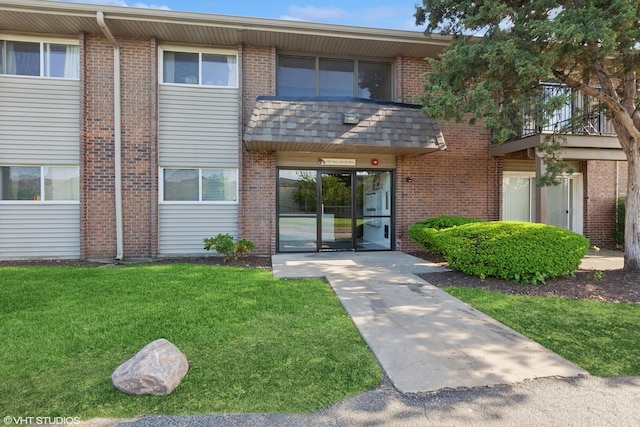 2301 Beau Monde Blvd Unit 106, Lisle, IL 60532 - view of front of home with a front yard and brick siding
