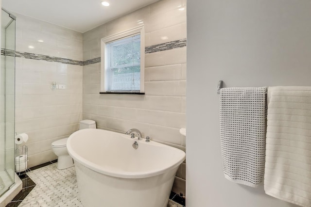 5319 W Cullom Ave, Chicago, IL 60641 - bathroom featuring a soaking tub, a shower stall, tile walls, and toilet