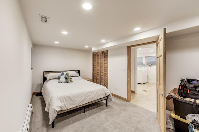 5319 W Cullom Ave, Chicago, IL 60641 - bedroom featuring washer / dryer, recessed lighting, a baseboard heating unit, light carpet, and baseboards
