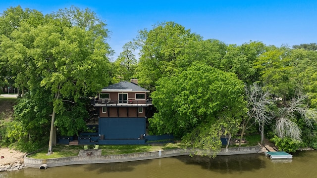 605 N 4th St, Oregon, IL 61061 - back of property with a water view, a balcony, and a chimney