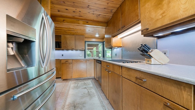 605 N 4th St, Oregon, IL 61061 - kitchen featuring appliances with stainless steel finishes, wood ceiling, light countertops, and brown cabinets