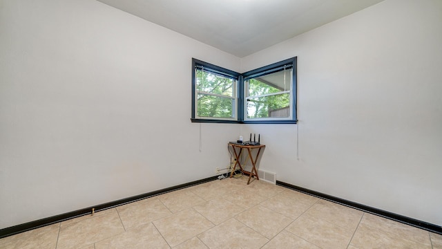 605 N 4th St, Oregon, IL 61061 - unfurnished room with light tile patterned floors and baseboards
