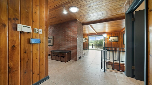 605 N 4th St, Oregon, IL 61061 - hallway with wooden ceiling with exposed beams, wooden walls, light tile patterned flooring, and a water view