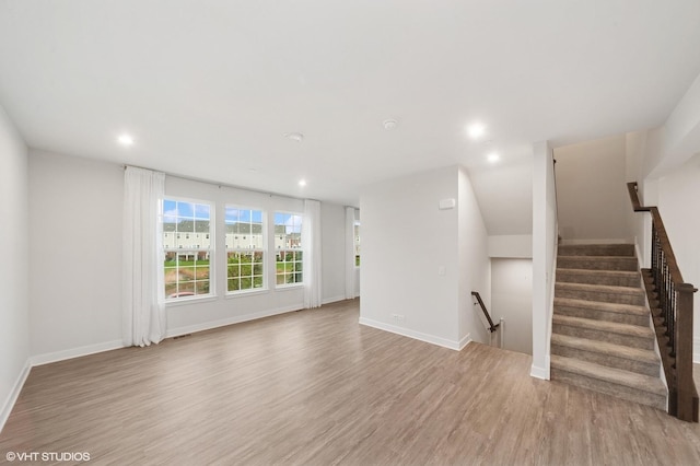 790 Weller Dr, Des Plaines, IL 60016 - unfurnished living room featuring light wood finished floors, recessed lighting, baseboards, and stairs