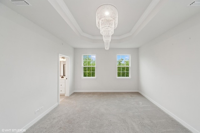 790 Weller Dr, Des Plaines, IL 60016 - empty room featuring a chandelier, light colored carpet, a tray ceiling, and baseboards