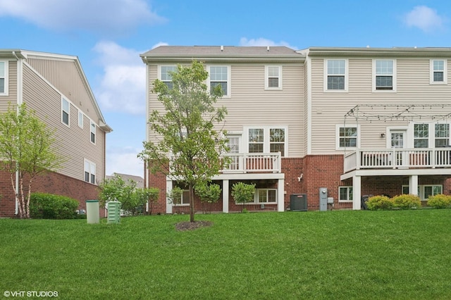 790 Weller Dr, Des Plaines, IL 60016 - rear view of house featuring brick siding, a lawn, central AC unit, and a deck