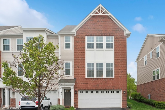 790 Weller Dr, Des Plaines, IL 60016 - view of front of home with brick siding, a garage, and driveway