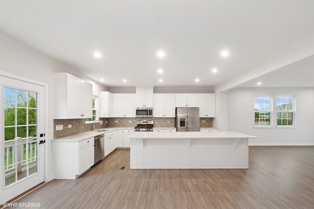 790 Weller Dr, Des Plaines, IL 60016 - kitchen featuring stainless steel appliances, backsplash, light countertops, and recessed lighting