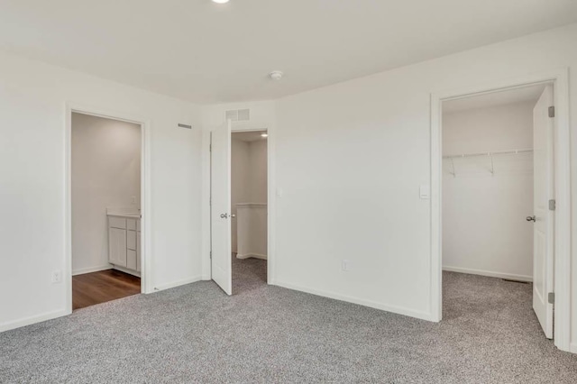 1554 Sequoia Way, Pingree Grove, IL 60140 - unfurnished bedroom featuring carpet, a spacious closet, a closet, baseboards, and connected bathroom