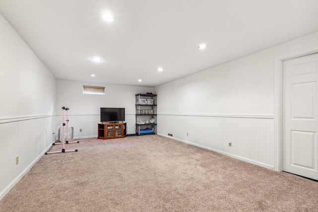 307 Shelden Dr, Winnebago, IL 61088 - unfurnished living room with carpet, recessed lighting, and a wainscoted wall