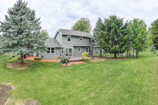 307 Shelden Dr, Winnebago, IL 61088 - rear view of house featuring a shingled roof and a patio area