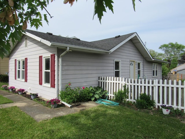 1503 Cherokee Dr, Round Lake Beach, IL 60073 - view of side of home with a shingled roof