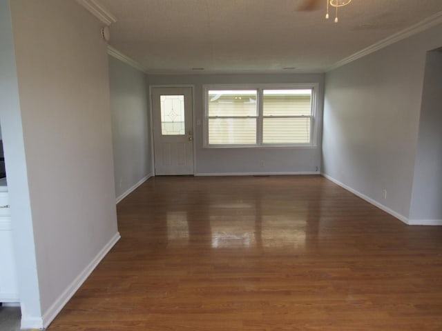 1503 Cherokee Dr, Round Lake Beach, IL 60073 - unfurnished room with crown molding, wood finished floors, baseboards, and ceiling fan