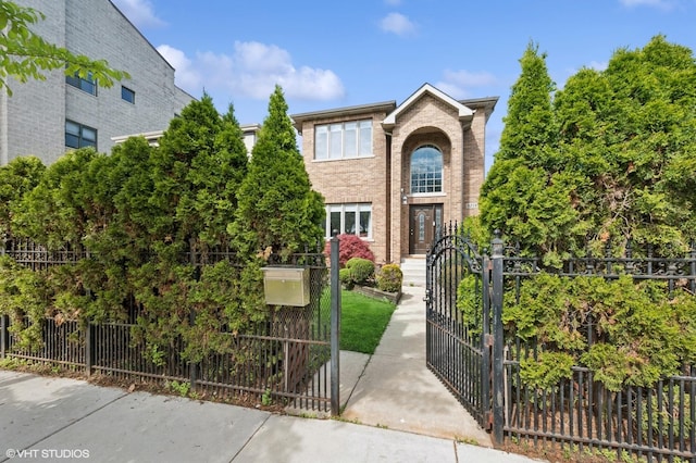 4218 N California Ave, Chicago, IL 60618 - traditional-style home featuring a gate, a fenced front yard, and brick siding