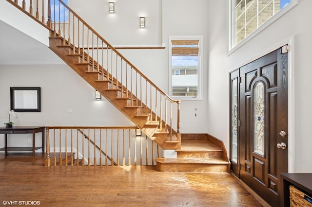 4218 N California Ave, Chicago, IL 60618 - foyer with a high ceiling, wood finished floors, and stairway