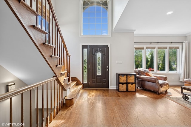 4218 N California Ave, Chicago, IL 60618 - foyer featuring wood finished floors, baseboards, ornamental molding, stairway, and recessed lighting
