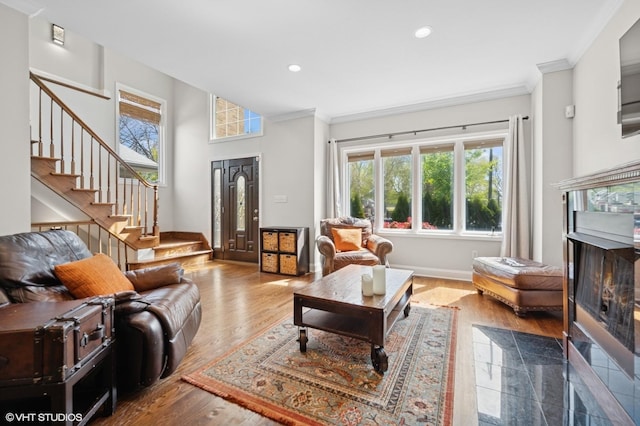 4218 N California Ave, Chicago, IL 60618 - living room with ornamental molding, stairway, a high end fireplace, recessed lighting, and wood finished floors