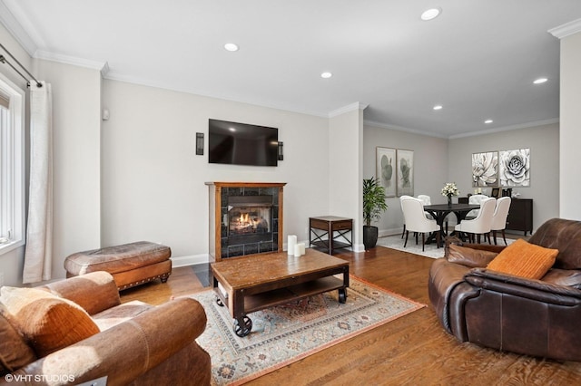4218 N California Ave, Chicago, IL 60618 - living room with recessed lighting, wood finished floors, a premium fireplace, crown molding, and baseboards