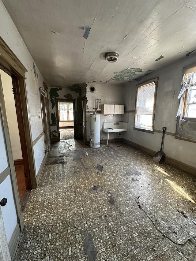 4636 S Wolcott Ave, Chicago, IL 60609 - kitchen with gas water heater, healthy amount of natural light, and a sink