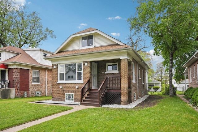 8428 S Rhodes Ave, Chicago, IL 60619 - view of front of home featuring brick siding and a front yard
