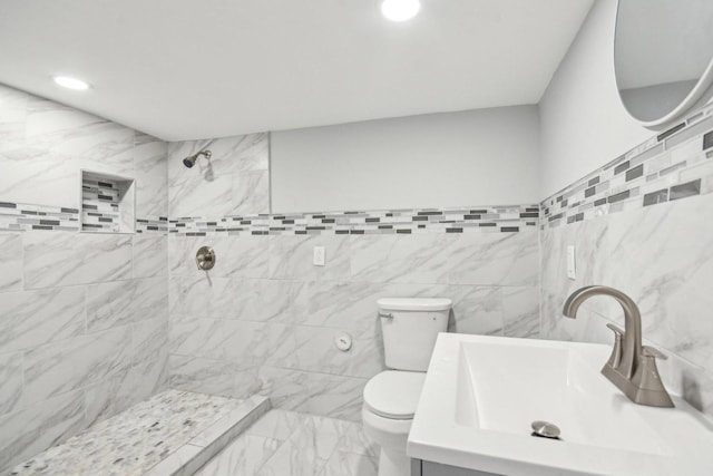 8428 S Rhodes Ave, Chicago, IL 60619 - full bathroom with toilet, tiled shower, tile walls, recessed lighting, and vanity