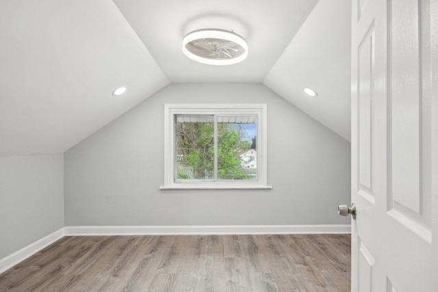 8428 S Rhodes Ave, Chicago, IL 60619 - additional living space with wood finished floors, lofted ceiling, baseboards, and recessed lighting