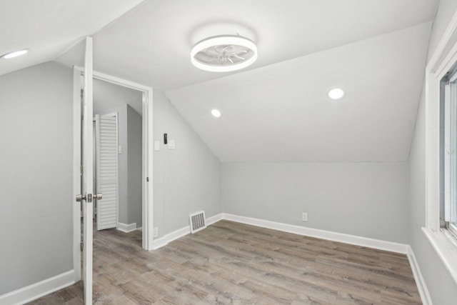 8428 S Rhodes Ave, Chicago, IL 60619 - bonus room with lofted ceiling, wood finished floors, baseboards, and recessed lighting