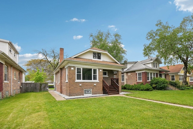 8428 S Rhodes Ave, Chicago, IL 60619 - bungalow-style house with brick siding and a chimney