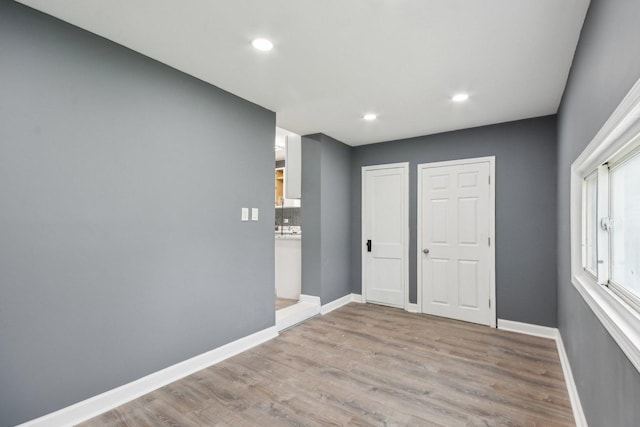 8428 S Rhodes Ave, Chicago, IL 60619 - unfurnished room with wood finished floors, baseboards, and recessed lighting