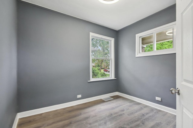 8428 S Rhodes Ave, Chicago, IL 60619 - unfurnished room featuring baseboards and wood finished floors
