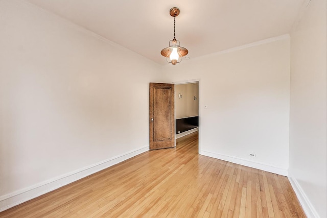 7350 N Ridge Blvd Unit 21B, Chicago, IL 60645 - spare room with light wood-style floors, baseboards, and crown molding
