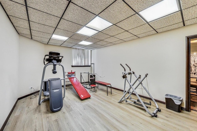 7350 N Ridge Blvd Unit 21B, Chicago, IL 60645 - workout area featuring wood finished floors, baseboards, and a paneled ceiling
