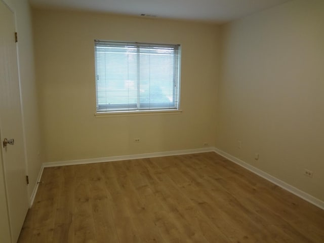 1108 Castilian Ct Unit 121, Glenview, IL 60025 - empty room with light wood-style floors and baseboards