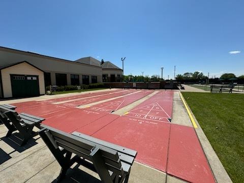 21142 W Braxton Ln Unit 21142, Plainfield, IL 60544 - surrounding community with shuffleboard and a yard