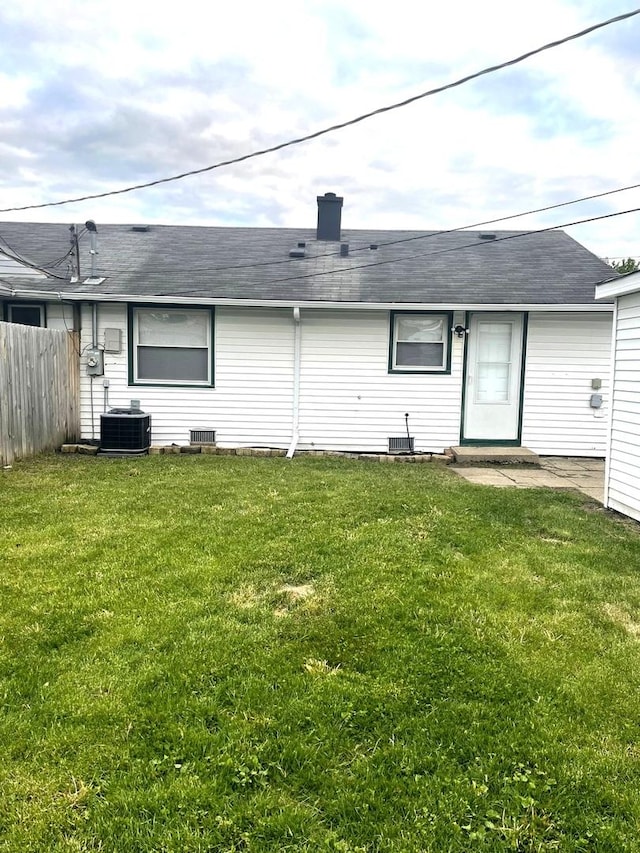4120 W 90th St, Hometown, IL 60456 - back of property with a shingled roof and central AC unit