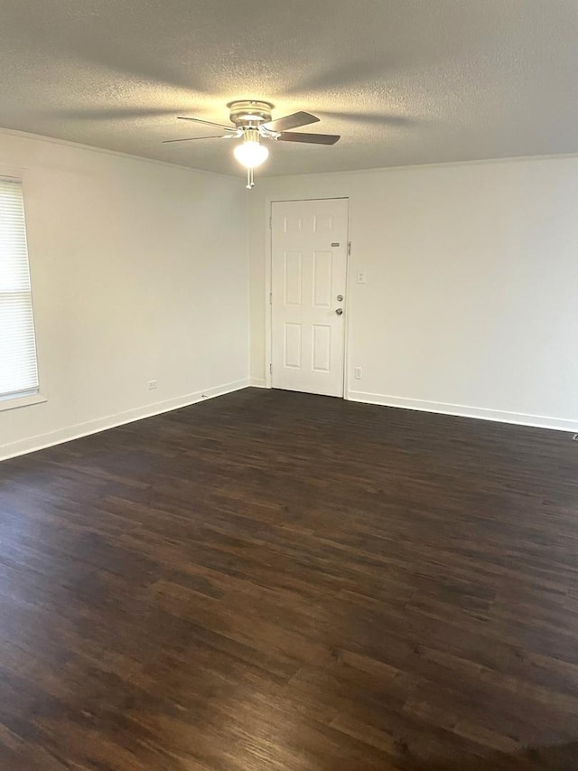 4120 W 90th St, Hometown, IL 60456 - unfurnished room featuring dark wood-style flooring, ceiling fan, baseboards, and a textured ceiling