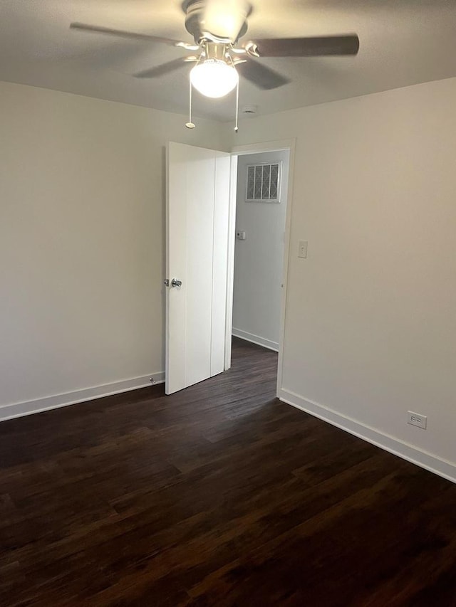 4120 W 90th St, Hometown, IL 60456 - empty room featuring ceiling fan, dark wood-style flooring, and baseboards