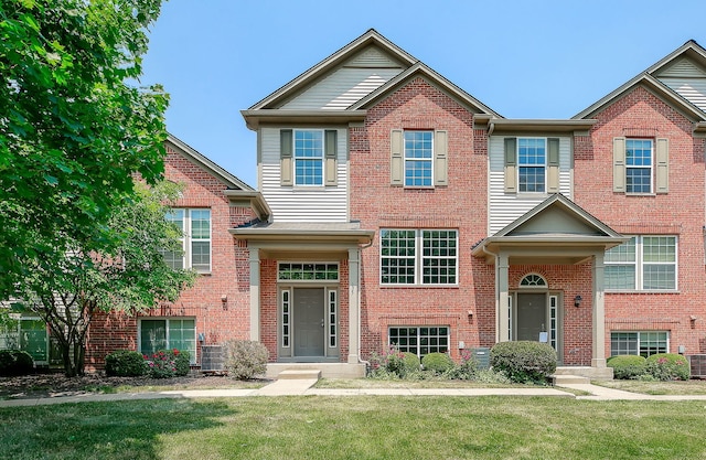 635 Conservatory Ln Unit 635, Aurora, IL 60502 - view of front facade with a front lawn and brick siding