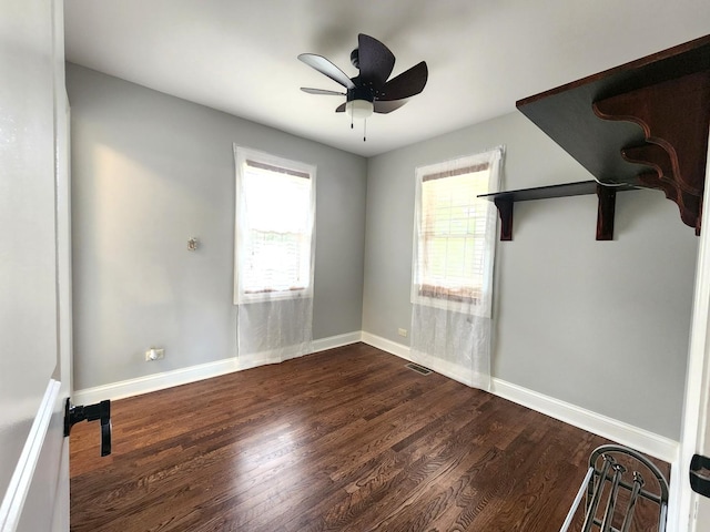 5115 E Ln, Mchenry, IL 60050 - empty room with dark wood-style flooring, baseboards, and a ceiling fan