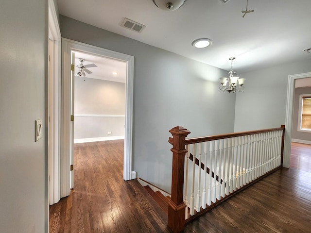 5115 E Ln, Mchenry, IL 60050 - hallway featuring an upstairs landing, dark wood-style flooring, a chandelier, and baseboards