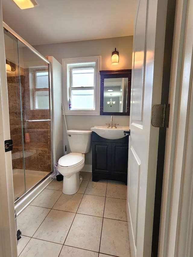 5115 E Ln, Mchenry, IL 60050 - bathroom with vanity, toilet, a shower stall, and tile patterned flooring