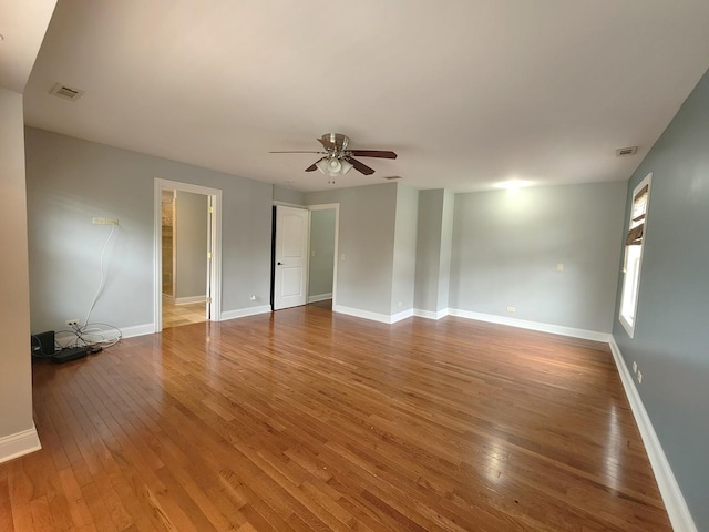 5115 E Ln, Mchenry, IL 60050 - empty room featuring a ceiling fan, wood-type flooring, and baseboards