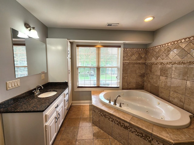 5115 E Ln, Mchenry, IL 60050 - bathroom featuring vanity, a jetted tub, and baseboards