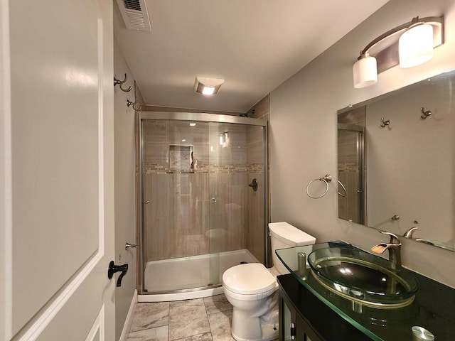 5115 E Ln, Mchenry, IL 60050 - bathroom featuring a shower stall, toilet, vanity, and marble look tiles