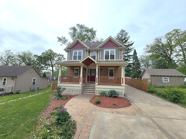 5115 E Ln, Mchenry, IL 60050 - craftsman-style house with covered porch, driveway, central air condition unit, and brick siding