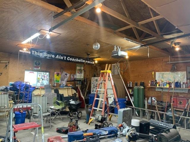 122 Portland Ave, Oglesby, IL 61348 - garage featuring a workshop area and a garage door opener